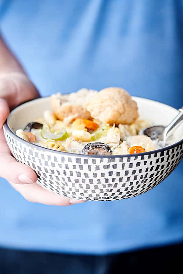 crockpot creamy chicken noodle soup bowl held