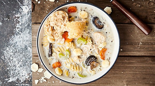 This Crockpot Creamy Chicken Noodle Soup Recipe is packed with healthy foods like lean chicken, veggies: onion, garlic, carrots, celery, mushrooms - and spices. It's also SO creamy and satisfying thanks to a bit of half & half, a touch of cream cheese, and rotini pasta noodles. Hearty, but not heavy at all! The perfect cozy winter soup. showmetheyummy.com #crockpot #chickennoodlesoup #chicken #soup #pasta