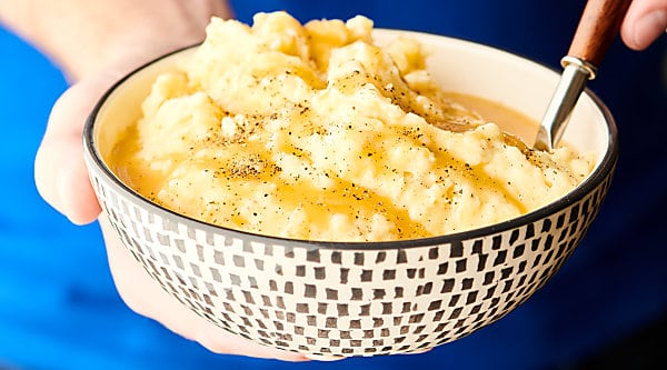 Instant Pot Mashed Potatoes. Yukon gold potatoes cooked in broth, then drained and mixed with buttermilk, butter, cream cheese, sour cream, parmesan cheese, and spices: salt, pepper, and garlic powder. Only 12 minutes required! Quick. Easy. Fluffy. Delicious! showmetheyummy.com #instantpot #mashedpotatoes