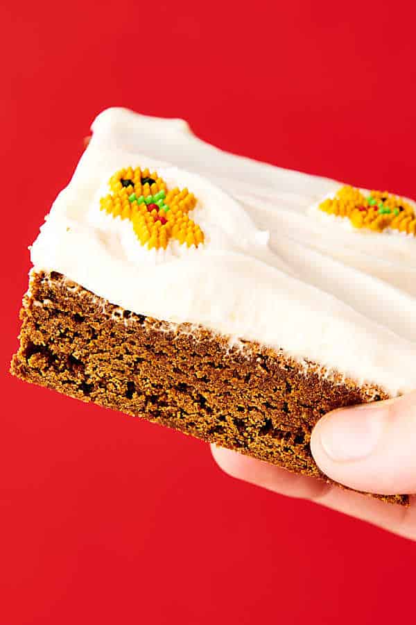 Gingerbread Cookie Bars. A cross between a cookie and a brownie, these bars are soft, chewy, dense, yet so light and full of cozy gingerbread spices. Perfect served warm with vanilla ice cream or served room temperature or chilled with an easy fluffy cream cheese frosting! showmetheyummy.com #gingerbread #cookie #bars #creamcheese #frosting