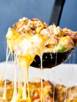 This Overnight Breakfast Sausage Casserole can be prepped and made the night before! Store it in your fridge overnight and bake the next morning. Quick, easy, and loaded with sausage, peppers, onions, toasted bread, eggs, milk, and of course, cheese! showmetheyummy.com #overnightbreakfastcasserole #breakfast #casserole #sausage #eggs #cheese #bread