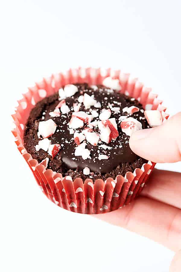 peppermint mocha cookie cup held white background