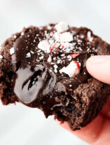 Peppermint Mocha Cookie Cups. A chewy, peppermint mocha cookie is filled with the most delicious fudge filling. Serve room temperature with crushed peppermint, chilled with whipped cream, or warm with vanilla ice cream! showmetheyummy.com #mint #chocolate #cookies #mocha #peppermintmocha #christmas