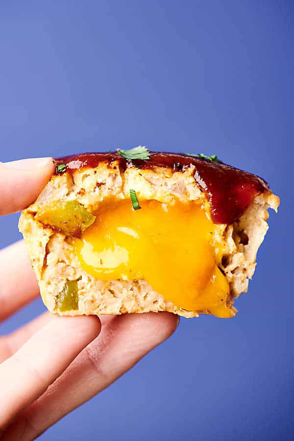 Healthy BBQ Cheddar Turkey Meatloaf Muffin Cups Recipe. These muffin tin meatloaves are loaded with oatmeal (trust me) instead of bread for a healthier twist, buttermilk, turkey, onion, peppers, spices, BBQ sauce, and a touch of cheddar cheese! Only 177 calories per cup!  showmetheyummy.com #bbq #cheddar #turkey #meatloaf #healthy #glutenfree
