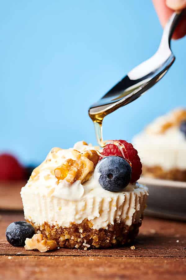 {New!} #ad Healthier Lemon Walnut No Bake Cheesecakes. A naturally sweetened walnut date crust topped with a creamy coconut yogurt, cream cheese, honey, lemon filling! I love this quick and easy recipe with short ingredient list! showmetheyummy.com Made in partnership w/ @cawalnuts #healthy #lemon #walnut #nobake #cheesecake #coconut #glutenfree #vegetarian #dessert #spring