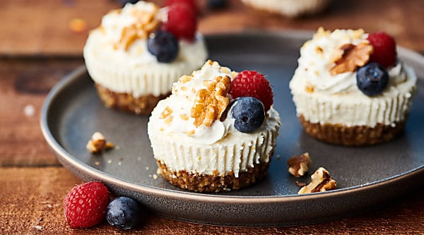 {New!} #ad Healthier Lemon Walnut No Bake Cheesecakes. A naturally sweetened walnut date crust topped with a creamy coconut yogurt, cream cheese, honey, lemon filling! I love this quick and easy recipe with short ingredient list! showmetheyummy.com Made in partnership w/ @cawalnuts #healthy #lemon #walnut #nobake #cheesecake #coconut #glutenfree #vegetarian #dessert #spring