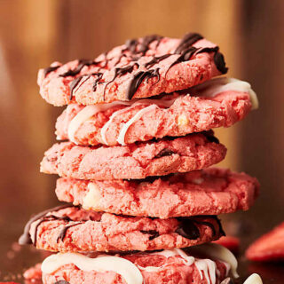 Strawberry Cake Mix Cookies. Cookies made with strawberry cake mix, strawberry jello, butter, eggs, and your choice of chocolate chips: dark, milk, or white! Quick, easy, delicious! 5 ingredients and 10 minute prep! showmetheyummy.com #strawberry #cakemix #cookies #chocolate