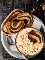This Easy Reuben Soup Recipe only requires 12 ingredients! It's loaded with celery, onions, garlic, a touch of butter and flour, chicken broth, fat free half-and-half, Russian dressing, Yukon gold potatoes, sauerkraut, corned beef, and swiss cheese (plus salt and pepper). Served with toasted marbled rye bread! showmetheyummy.com #reuben #soup