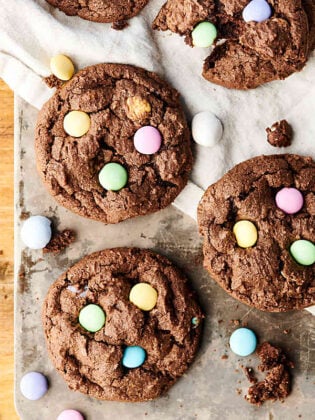 Double Chocolate Cadbury Egg Cookies. A chewy double chocolate cookie loaded with Cadbury Mini Eggs and Easter M&Ms! A quick and easy festive treat for Easter or spring! showmetheyummy.com #chocolate #easter #cookies #cadbury #m&ms