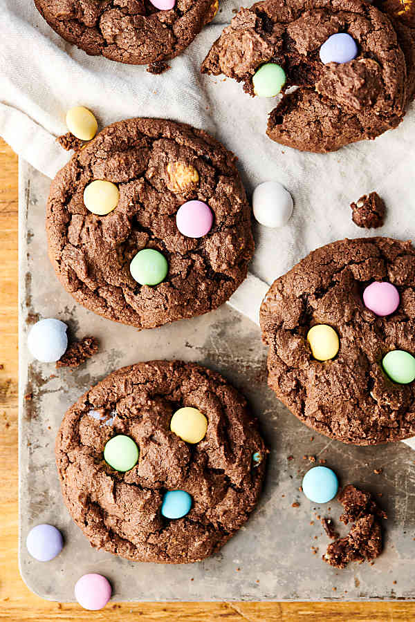 Double Chocolate Cadbury Egg Cookies. A chewy double chocolate cookie loaded with Cadbury Mini Eggs and Easter M&Ms! A quick and easy festive treat for Easter or spring! showmetheyummy.com #chocolate #easter #cookies #cadbury #m&ms