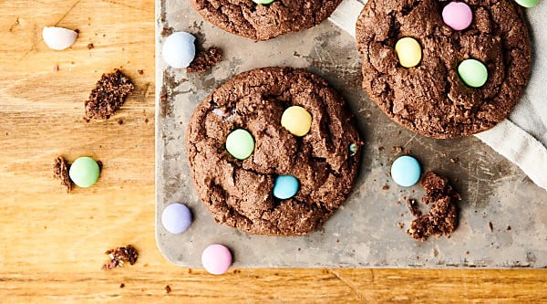 Double Chocolate Cadbury Egg Cookies. A chewy double chocolate cookie loaded with Cadbury Mini Eggs and Easter M&Ms! A quick and easy festive treat for Easter or spring! showmetheyummy.com #chocolate #easter #cookies #cadbury #m&ms
