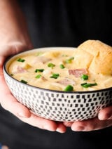 Ham and Cheese Potato Soup. A quick and easy classic loaded with veggies, chicken broth, half and half, potatoes, leftover ham, sour cream, cheddar cheese, and swiss cheese! Hearty, yet light! A family favorite. showmetheyummy.com #ham #cheese #potato #soup