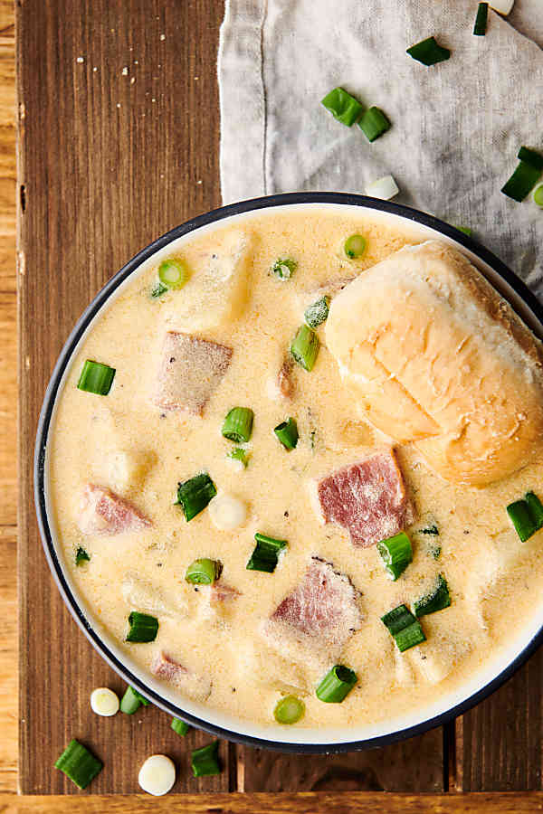 Bowl of ham and cheese potato soup above