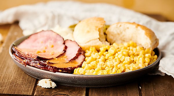 This Honey Dijon Crockpot Ham Recipe is the best combination of sweet and salty. Ham smothered in brown sugar, honey, butter, dijon mustard, and garlic and cooked to juicy perfection in the slow cooker! Quick and easy! showmetheyummy.com #crockpot #ham #honey #dijon