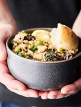 Instant Pot Mushroom Risotto. A classic made in the pressure cooker and loaded with butter, onions, spices, baby belly mushrooms, garlic, Arborio rice, a splash of wine, vegetable broth, baby spinach, peas, three kinds of cheese: asiago, romano, and parmesan, and fresh lemon juice/zest! A decadent vegetarian main or a creamy side dish to your favorite protein! showmetheyummy.com #instantpot #mushroom #risotto #glutenfree #vegetarian