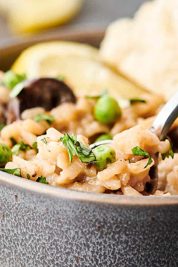 Closeup of instant pot mushroom risotto with fork