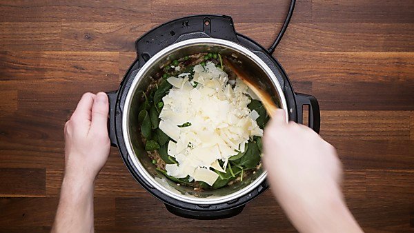 Cheese and spinach added into instant pot mushroom risotto