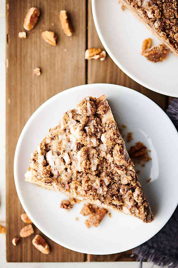 Slice of coffee cake on a plate above
