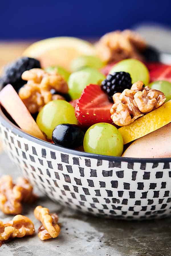 fruit salad with honey walnuts close up