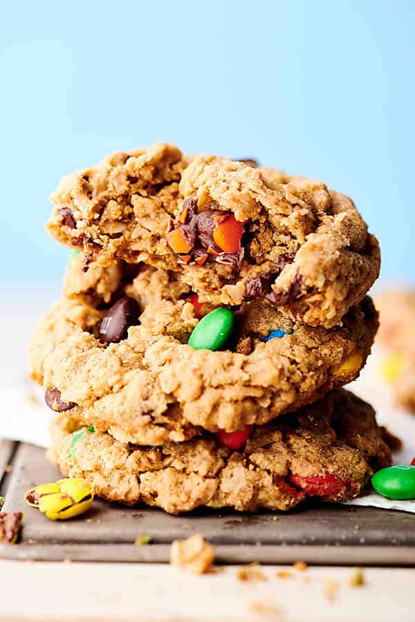 The Best Monster Cookie Recipe. Naturally gluten free cookies loaded with butter, brown sugar, granulated sugar, vanilla, creamy peanut butter, oats, M&Ms, and chocolate chips. They really are the best monster cookies ever! showmetheyummy.com #monstercookies #monster #cookie #glutenfree #peanutbutter #oats #chocolate