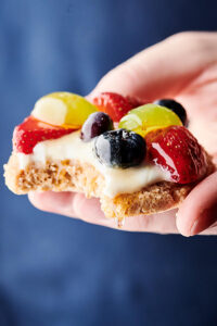 healthy fruit pizza cookies blue background