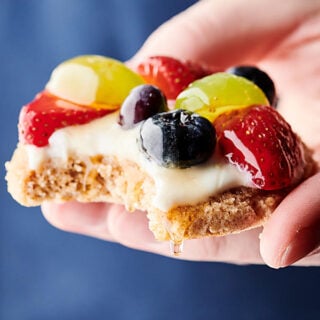 healthy fruit pizza cookies blue background