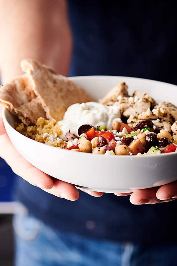 Healthy Greek Chicken Bowls holding