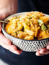 One Pot Chicken Broccoli Mac and Cheese holding in hands