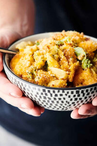 One Pot Chicken Broccoli Mac and Cheese holding in hands