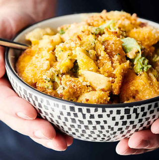 One Pot Chicken Broccoli Mac and Cheese holding in hands