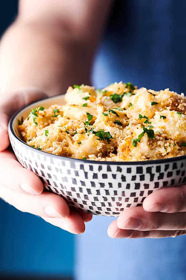 Crab Mac and Cheese holding in hands