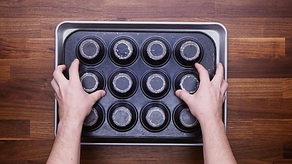 Lava cakes being removed from muffin tin