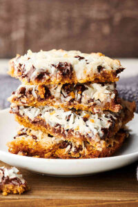 Magic Cookie Bars stacked on plate
