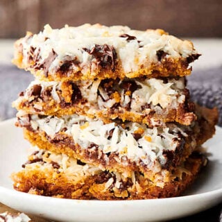 Magic Cookie Bars stacked on plate