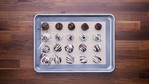 Oreo balls with chocolate drizzle and toppings