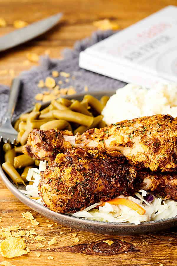 Air fryer fried chicken with green beans and mashed potatoes on a plate