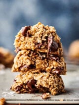 Three oatmeal chocolate chip cookies stacked