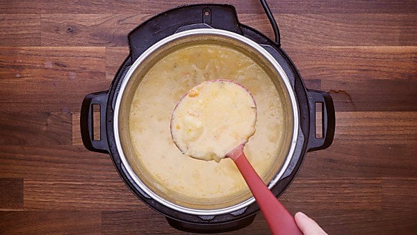 Cooked instant pot potato soup with ladle being taken out