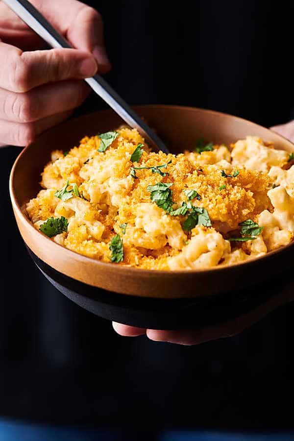 Bowl of baked mac and cheese held