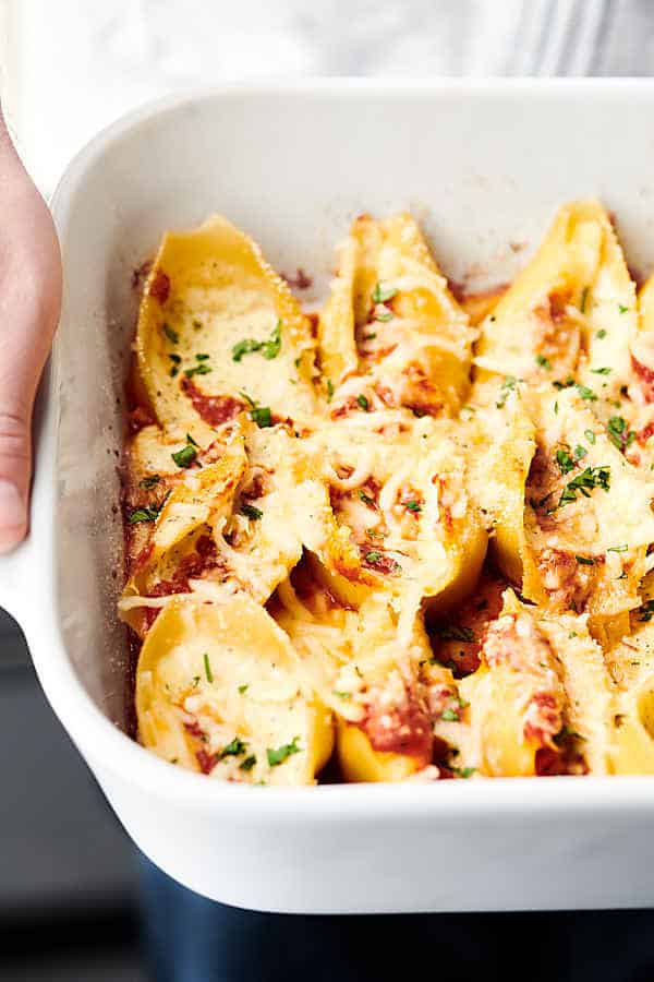 Baking pan of stuffed shells held