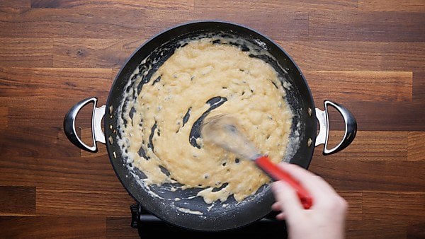 Liquids and flour whisked in skillet