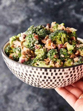 bowl of broccoli salad held