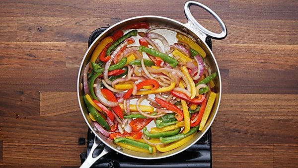 onions and peppers cooked in saute pan