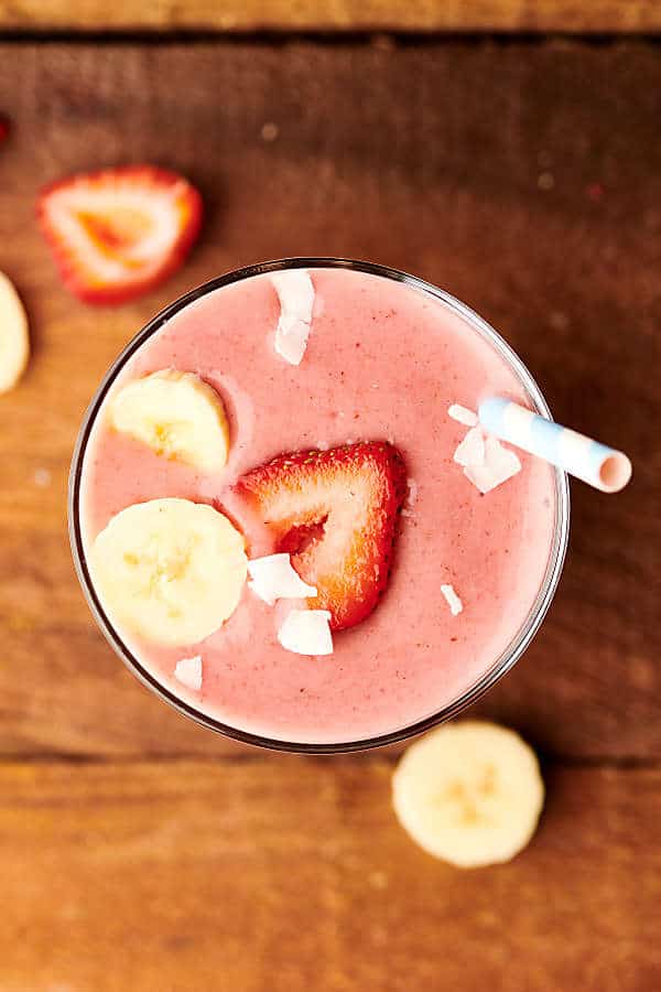 cup with strawberry banana smoothie above
