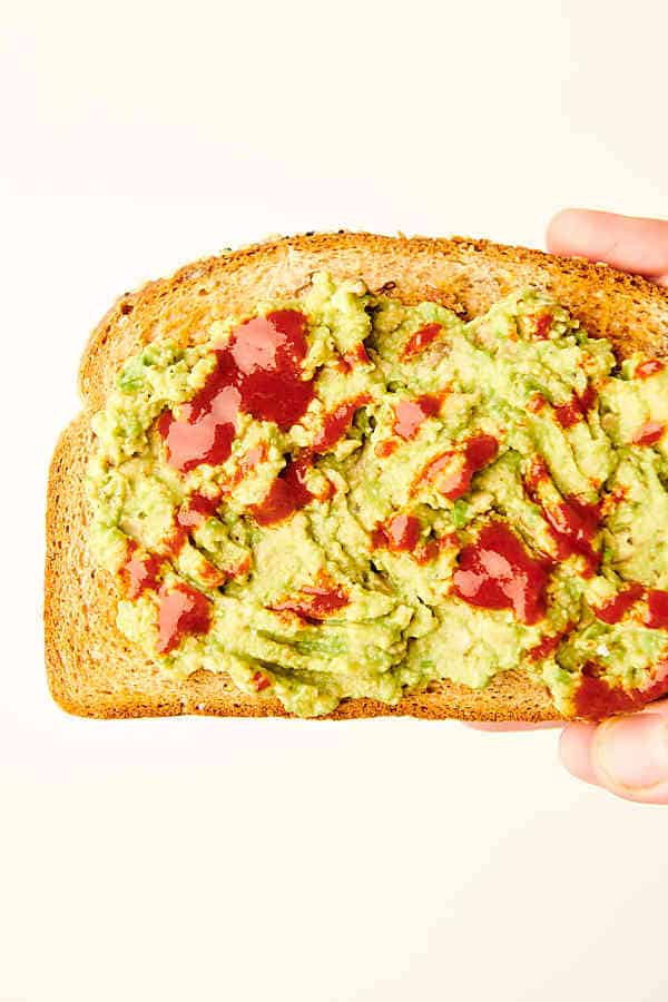 classic avocado toast held