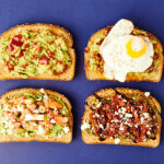four slices of avocado toast above