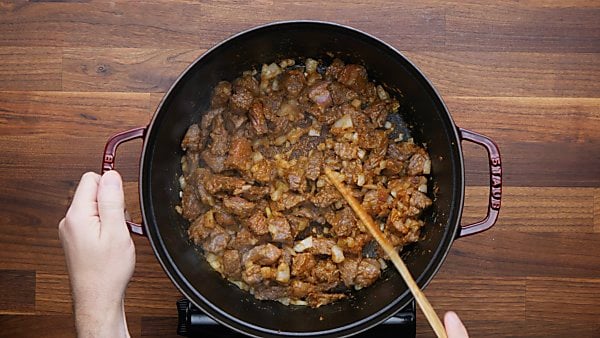 beef and onions cooked in pan