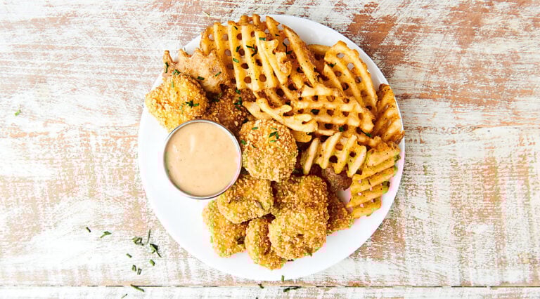chick fil a sauce on plate with waffle fries and chicken nuggets