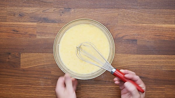 eggs, buttermilk, and salt whisked in mixing bowl