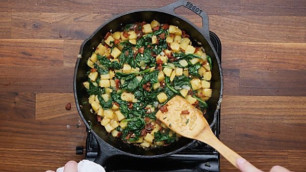 spinach and bacon added to onion/potatoes